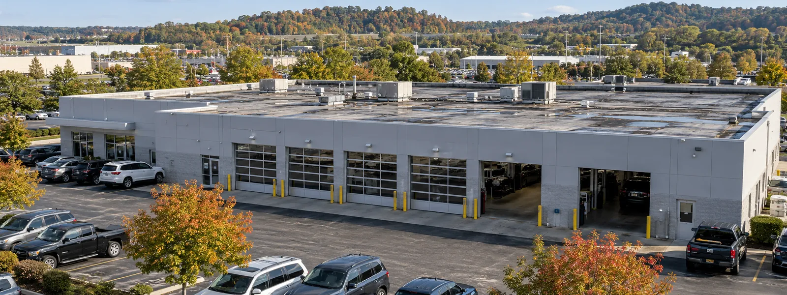 Flat-roofed commercial flex building with rooftop units and service bays in Florence, Kentucky